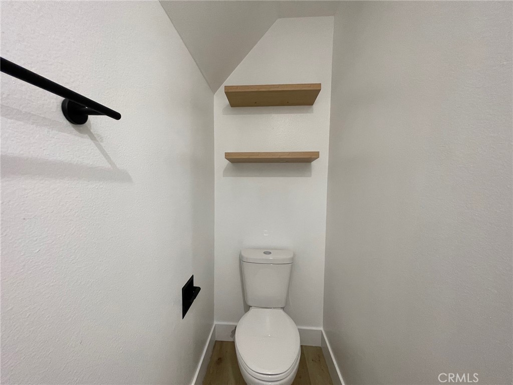 821 Calle Puente, Unit 3 San Clemente, CA 92672 - Photo 6 of 11 a white toilet sitting next to a white sink