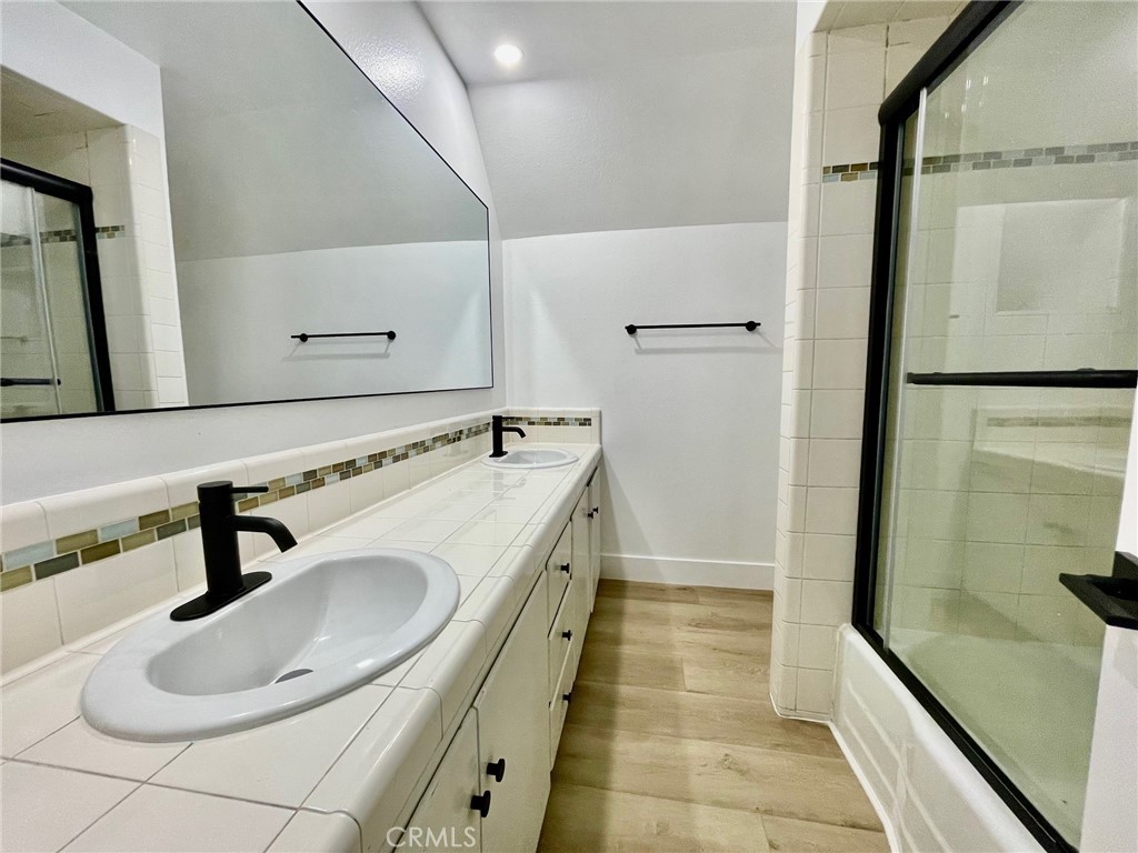 821 Calle Puente, Unit 3 San Clemente, CA 92672 - Photo 7 of 11 a bathroom with a sink and a mirror