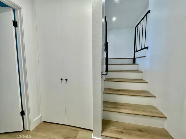 a kitchen with stainless steel appliances a refrigerator and a stove top oven