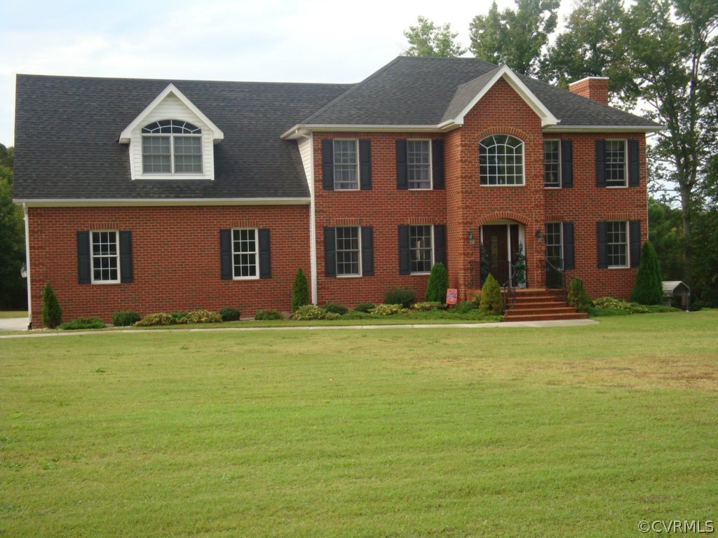 4267 Tatum Road Disputanta, VA 23842 - Photo 1 of 24 a front view of a house with a yard