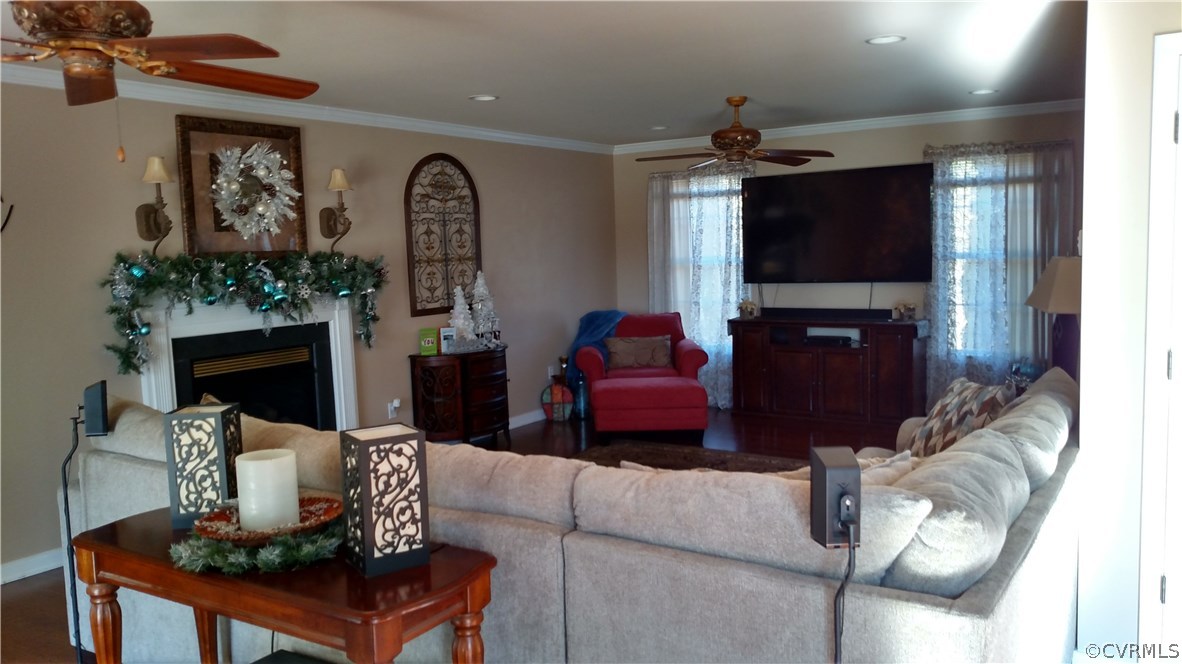 4267 Tatum Road Disputanta, VA 23842 - Photo 11 of 24 a living room with furniture and a flat screen tv