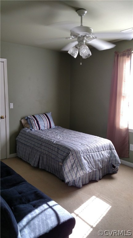 4267 Tatum Road Disputanta, VA 23842 - Photo 21 of 24 a bedroom with a bed and chandelier