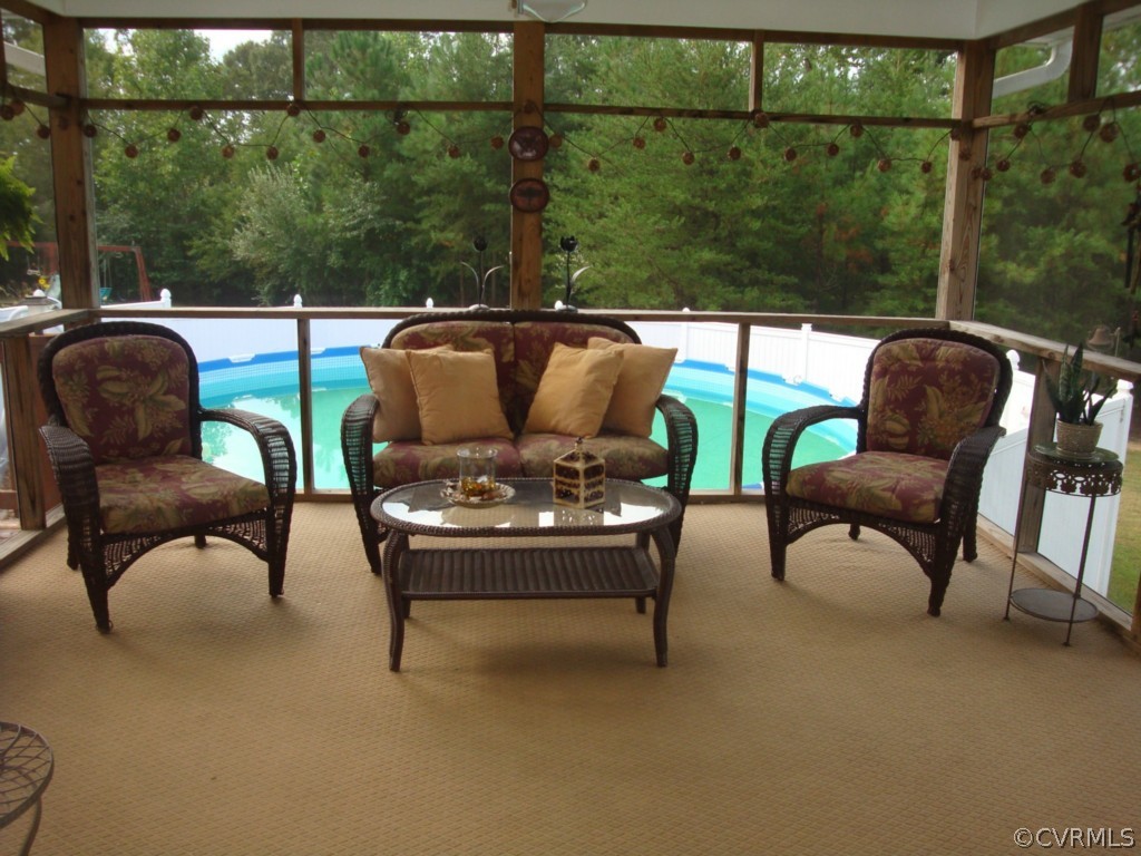 4267 Tatum Road Disputanta, VA 23842 - Photo 3 of 24 a view of a two chairs in the patio next to a yard