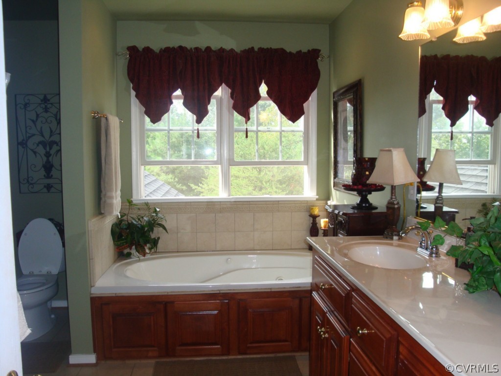 4267 Tatum Road Disputanta, VA 23842 - Photo 7 of 24 a bathroom with a sink and a bathtub