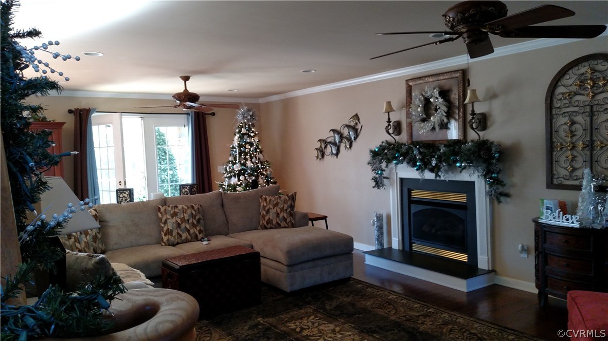 4267 Tatum Road Disputanta, VA 23842 - Photo 9 of 24 a living room with furniture and a fireplace