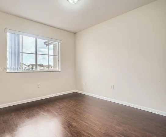 a view of a livingroom with wooden floor
