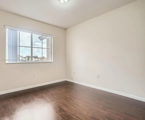 a view of a livingroom with wooden floor