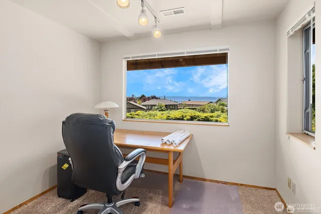 a work room with furniture and a window