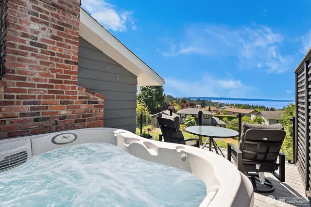 a view of a chairs and table in patio