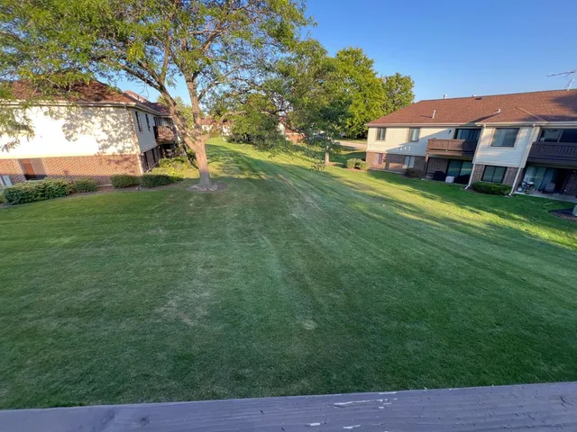 a view of a house with a big yard