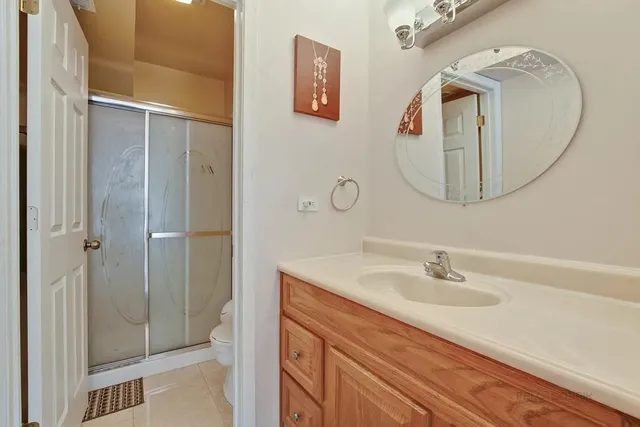 a bathroom with a sink vanity and a mirror