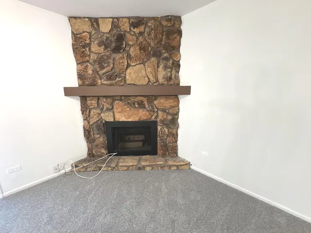 a living room with a fireplace