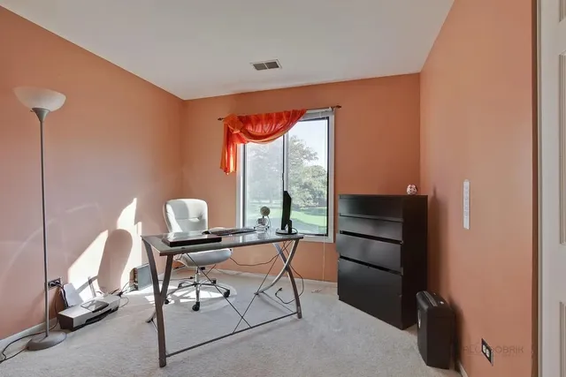 a room with furniture and a window