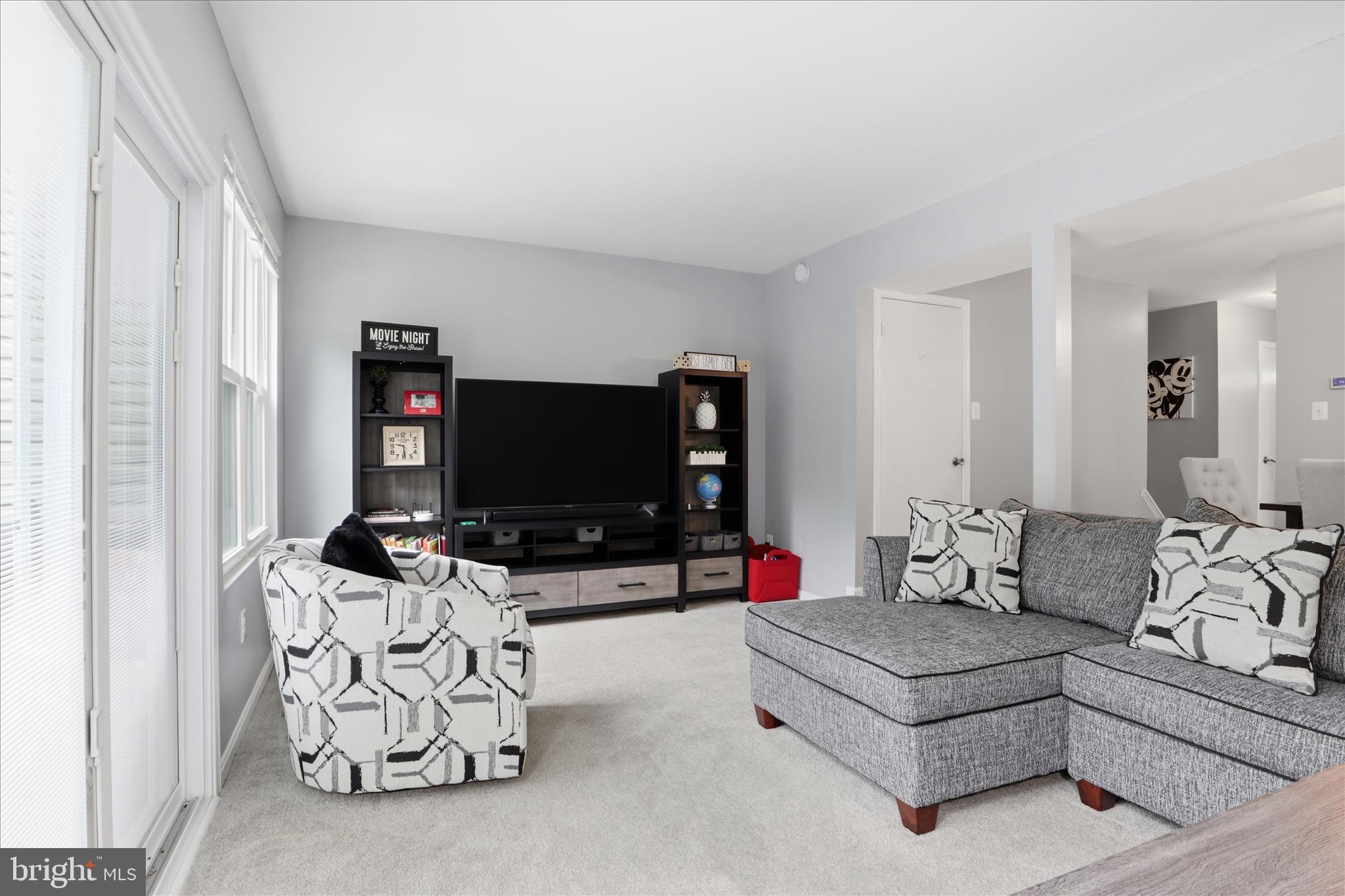 71 Kinsman View Circle Silver Spring, MD 20901 - Photo 4 of 42 a living room with furniture and a flat screen tv