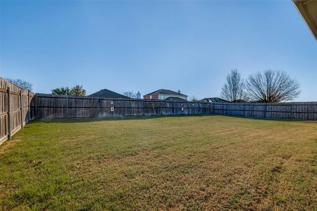 a view of a swimming pool with an outdoor space and seating area