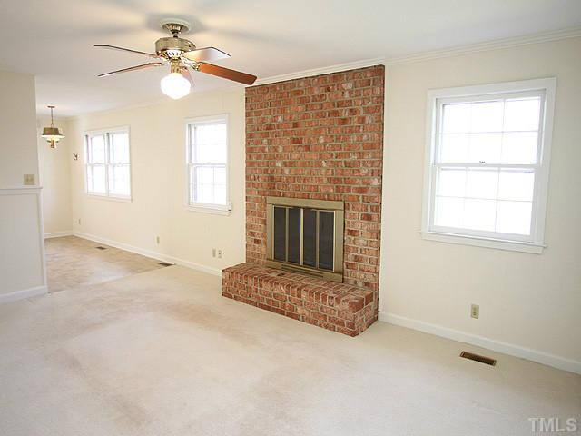 4512 Connell Drive Raleigh, NC 27612 - Photo 8 of 25 Hardwood Floors Under Carpet in Family Room.....2 fireplaces in home (one in basement recreation room) Den/Family/Great Room