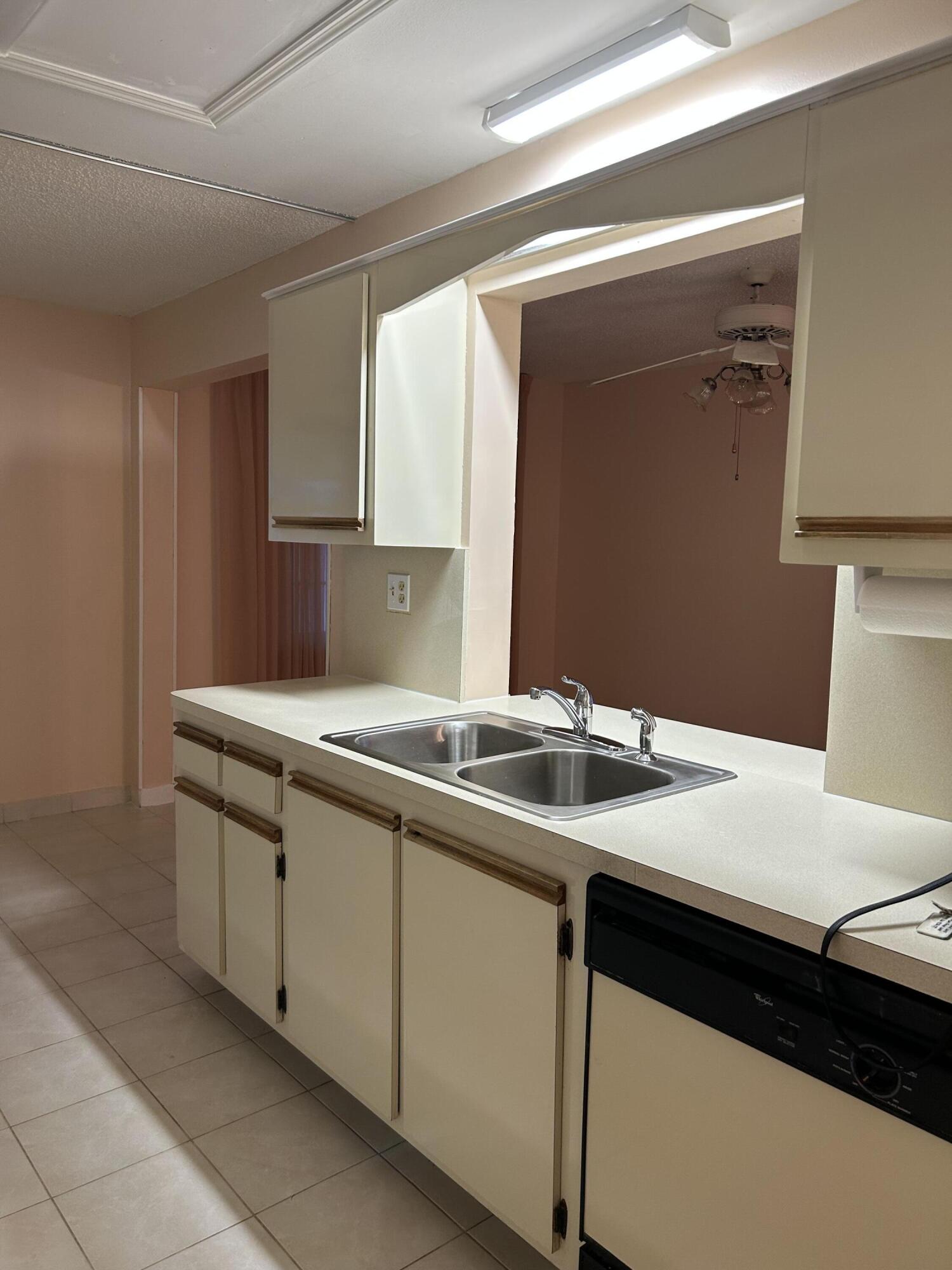 2003 Southwest 18th Street Boynton Beach, FL 33426 - Photo 3 of 11 a kitchen with a sink and cabinets
