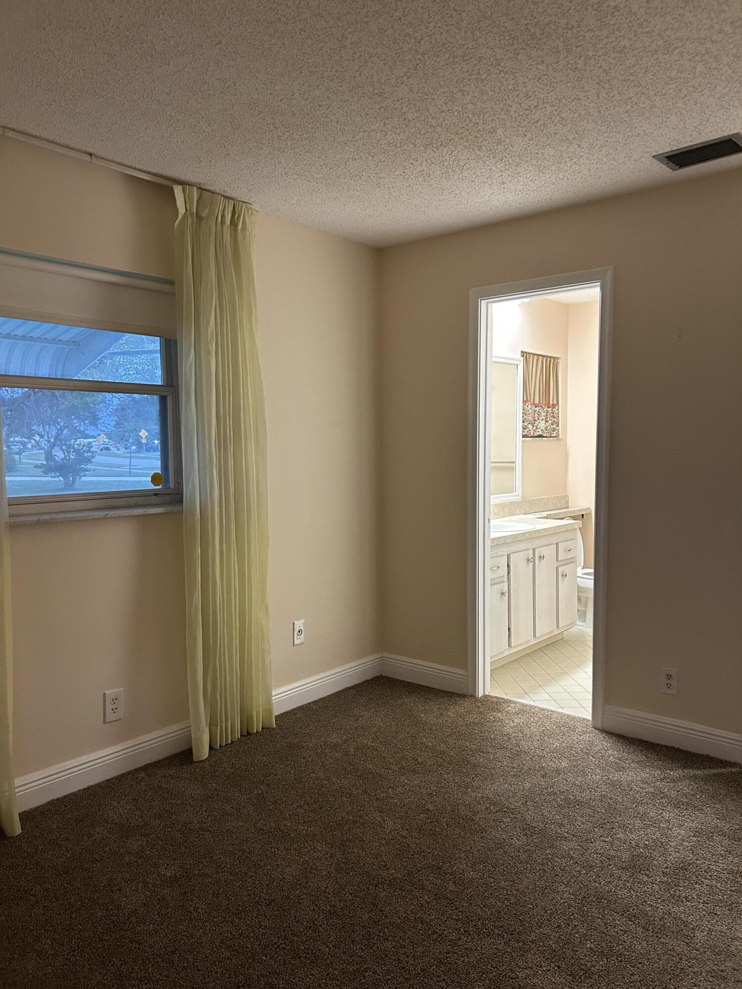 2003 Southwest 18th Street Boynton Beach, FL 33426 - Photo 8 of 11 an empty room with windows