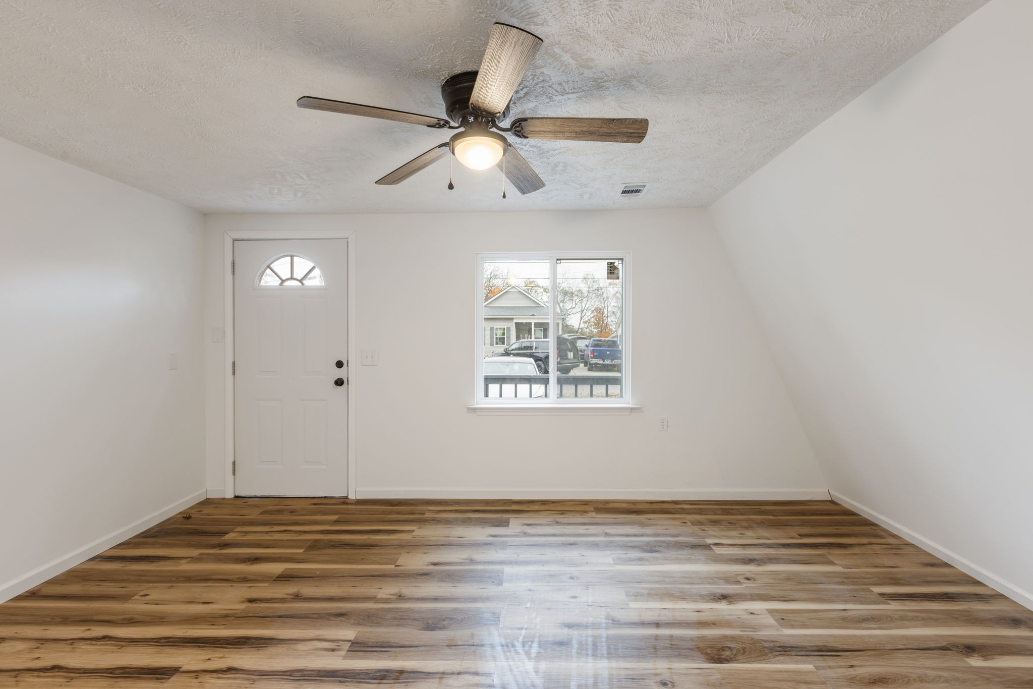 415 Durrett Street Springfield, TN 37172 - Photo 10 of 54 a view of empty room with wooden floor and fan
