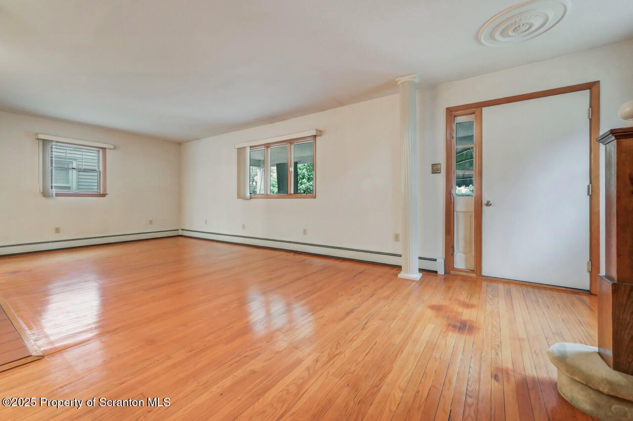 216 North Abington Road Clarks Green, PA 18411 - Photo 15 of 71 a view of an empty room with wooden floor and a window