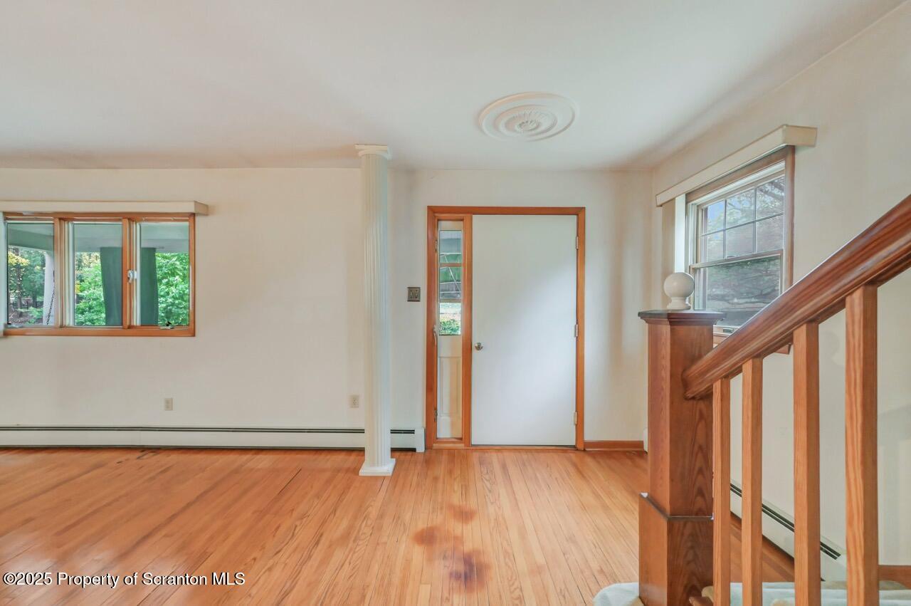 216 North Abington Road Clarks Green, PA 18411 - Photo 16 of 71 a view of an empty room with wooden floor and a window