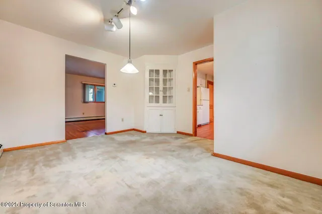 a large bathroom with a sink a mirror and a bathtub