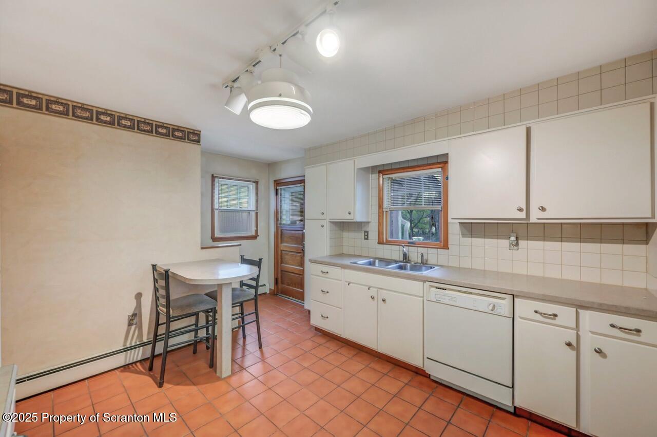 216 North Abington Road Clarks Green, PA 18411 - Photo 23 of 71 a large white kitchen with a sink and cabinets