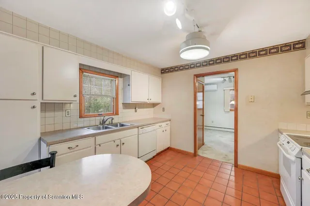 a view of an empty room with a fireplace