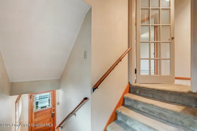 a bathroom with a sink mirror and shower
