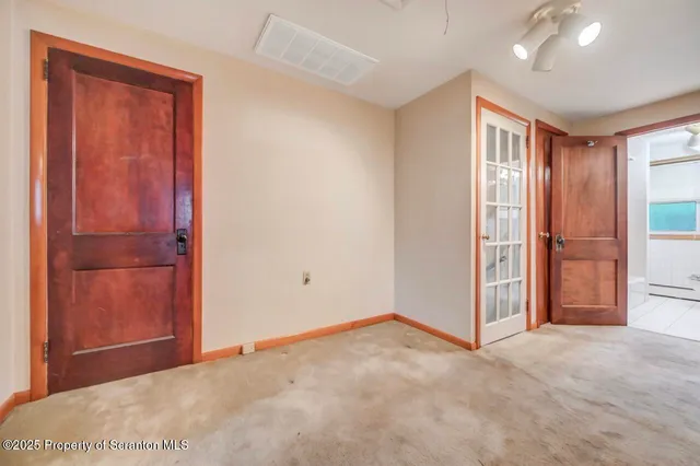 an empty room with windows