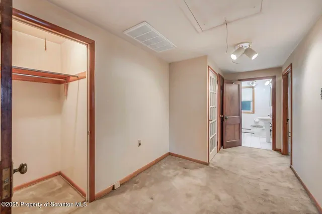 a view of a room with wooden walls