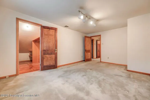 a view of a house with a small deck