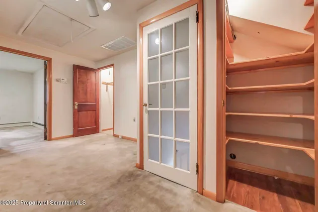 a picture of a bench in a white wall