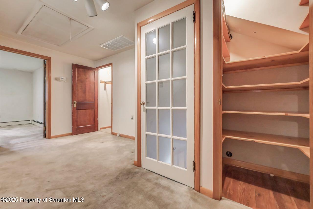 216 North Abington Road Clarks Green, PA 18411 - Photo 46 of 71 a view of an empty room with a cabinet and a window