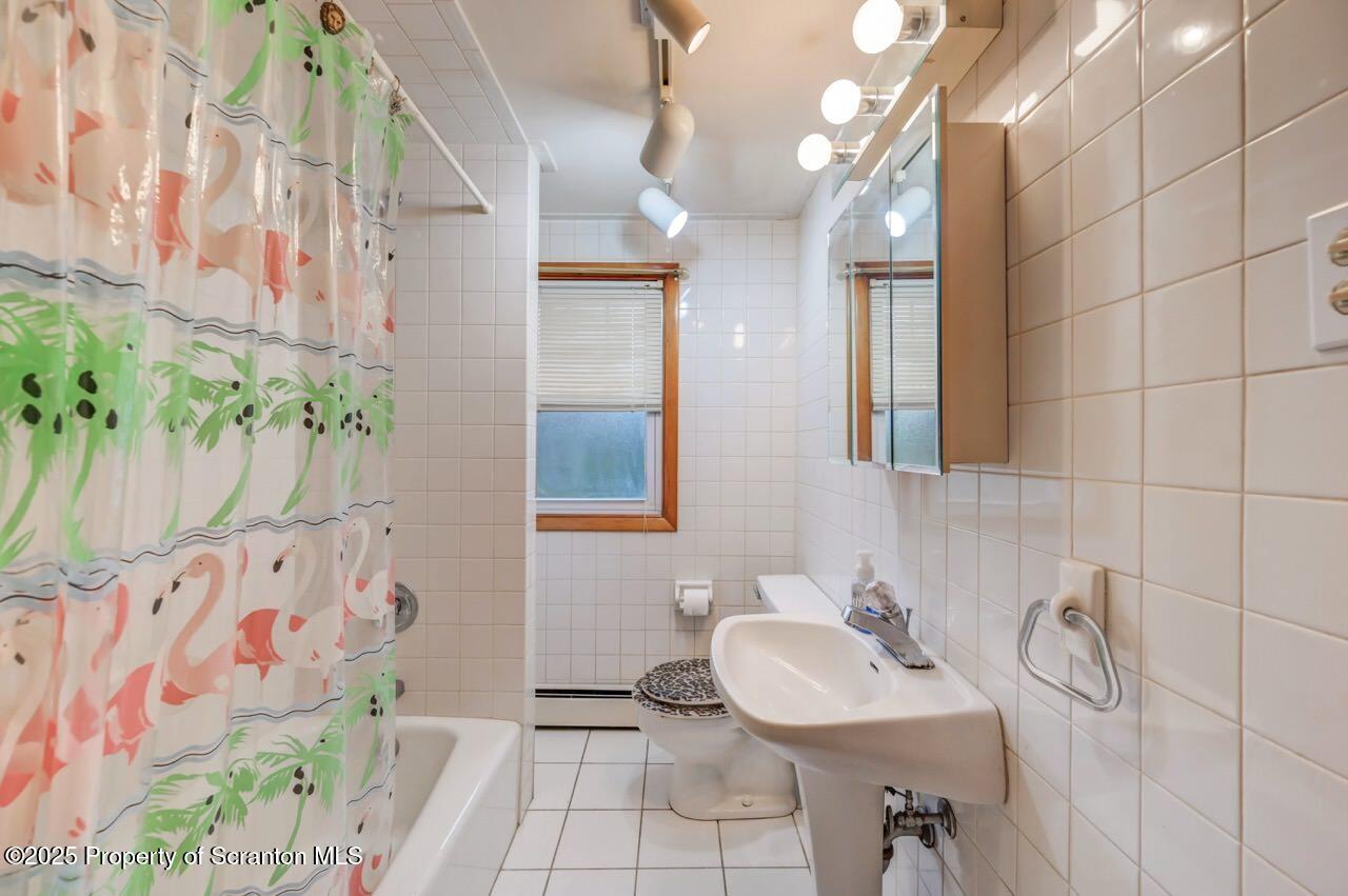 216 North Abington Road Clarks Green, PA 18411 - Photo 48 of 71 a bathroom with a sink vanity and a mirror