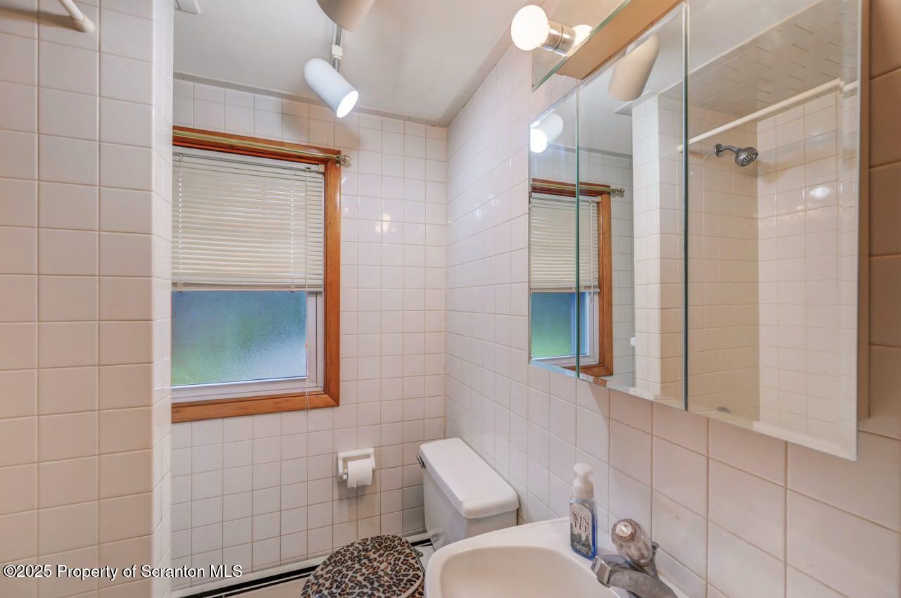 216 North Abington Road Clarks Green, PA 18411 - Photo 49 of 71 a bathroom with a toilet sink and shower