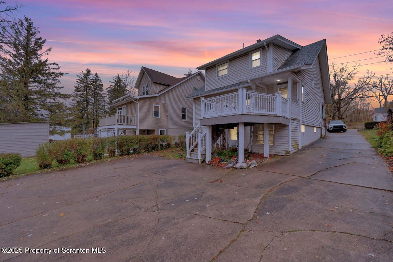 216 North Abington Road Clarks Green, PA 18411 - Photo 5 of 71 a view of a house with large trees and a small yard