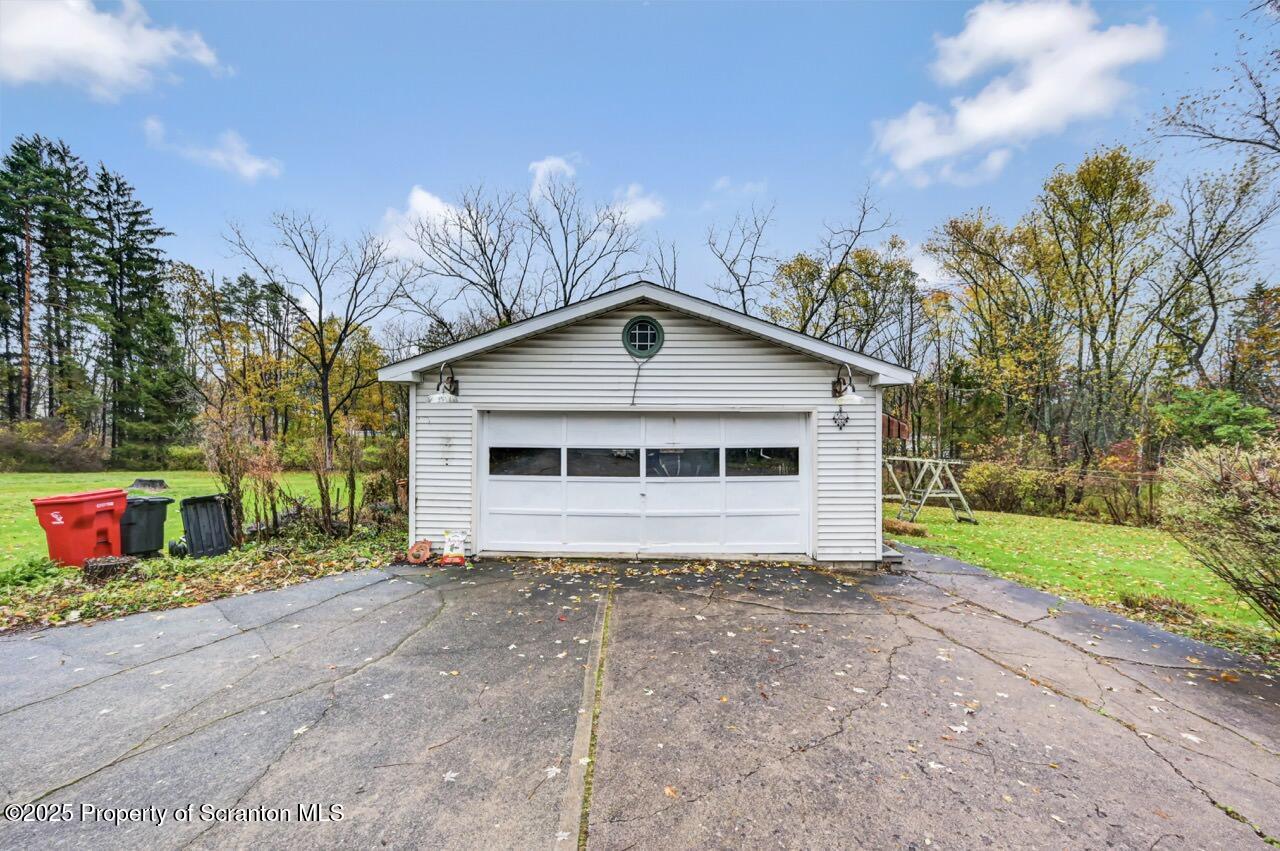 216 North Abington Road Clarks Green, PA 18411 - Photo 66 of 71 a front view of a house with garden
