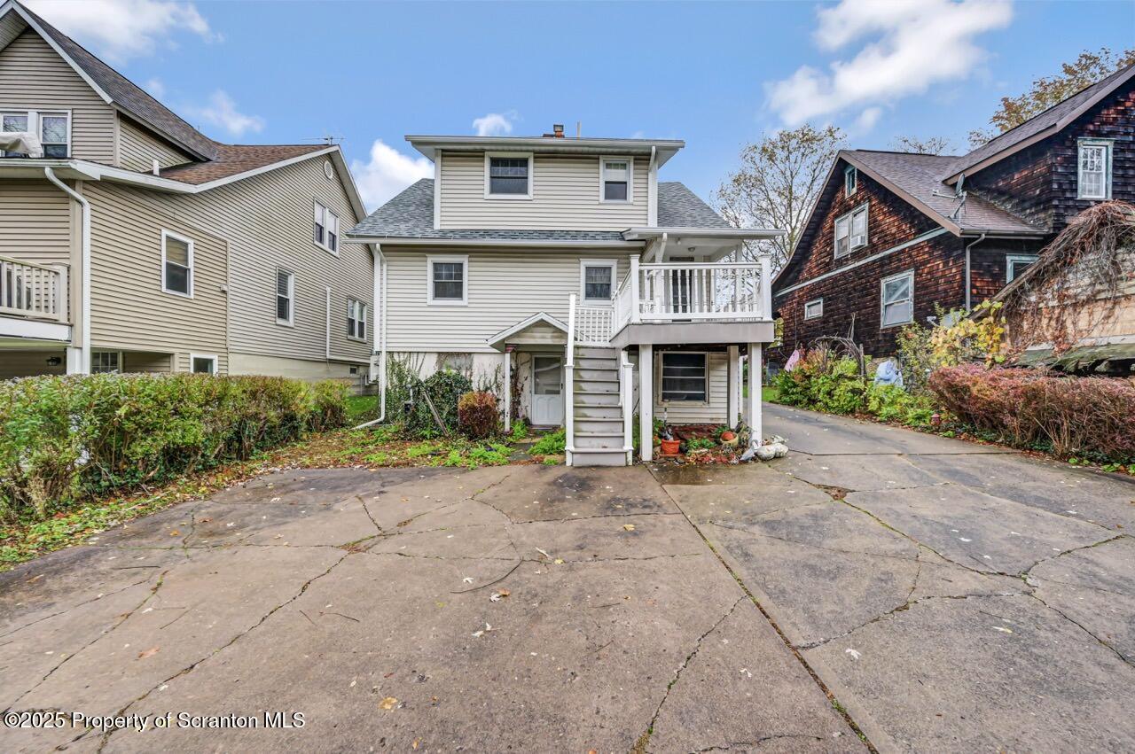 216 North Abington Road Clarks Green, PA 18411 - Photo 68 of 71 a view of a white house with large outdoor space and a street