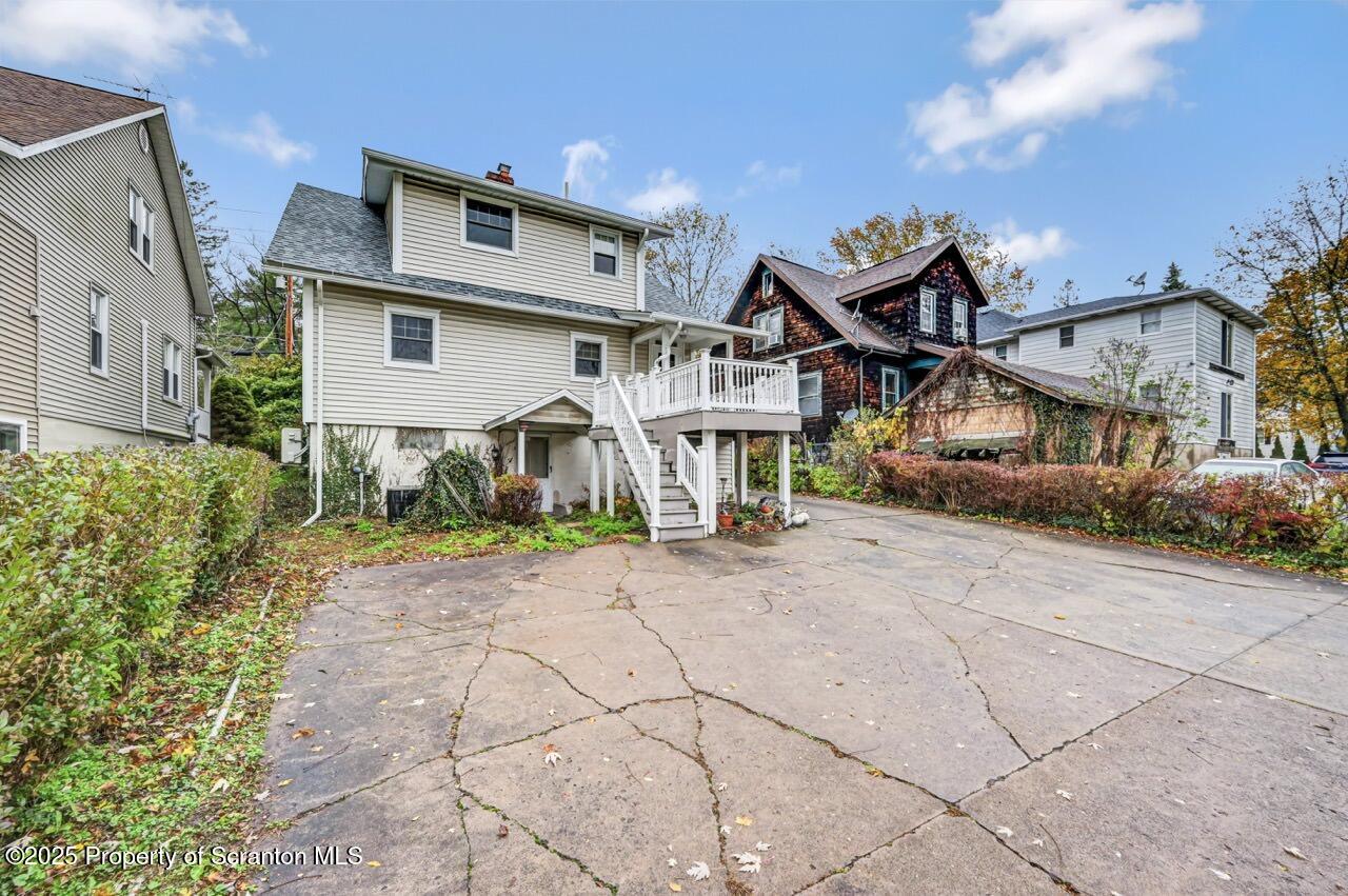 216 North Abington Road Clarks Green, PA 18411 - Photo 69 of 71 a front view of a house with a yard and garage