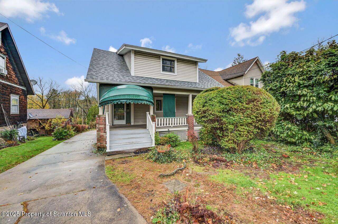 216 North Abington Road Clarks Green, PA 18411 - Photo 70 of 71 a front view of a house with garden