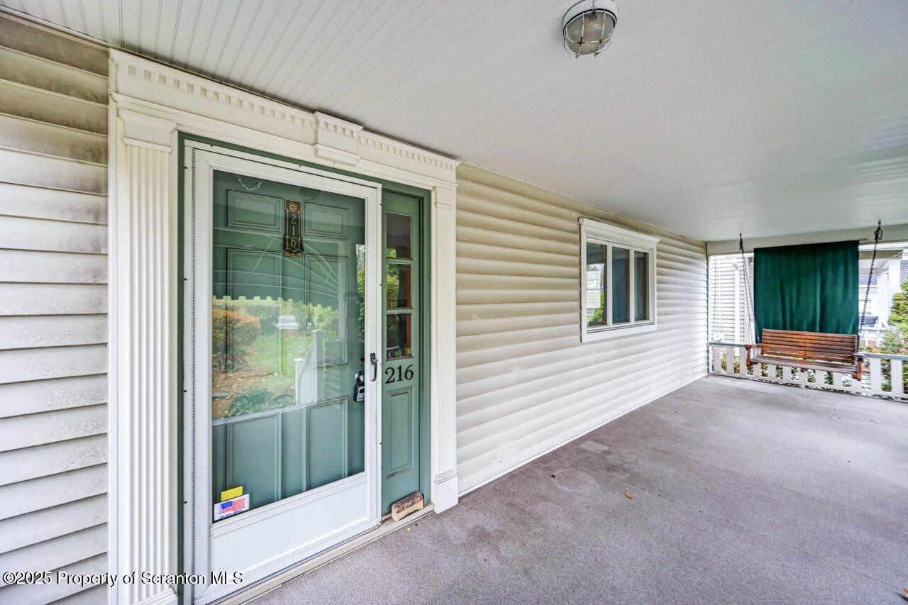 216 North Abington Road Clarks Green, PA 18411 - Photo 9 of 71 a view of an empty room with wooden floor and a window