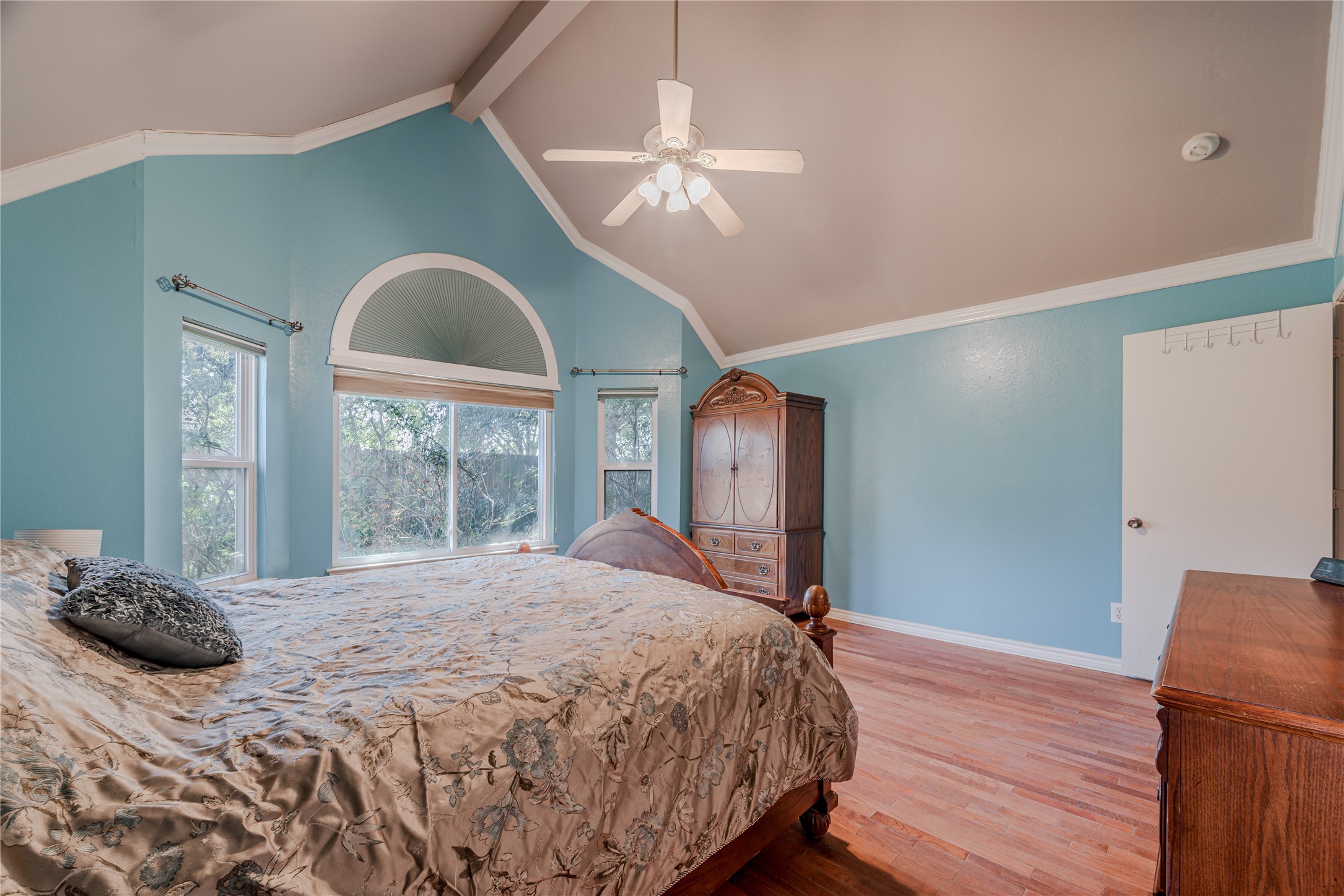 7714 Broken Arrow Street Baytown, TX 77521 - Photo 19 of 41 a bedroom with a bed and a large window