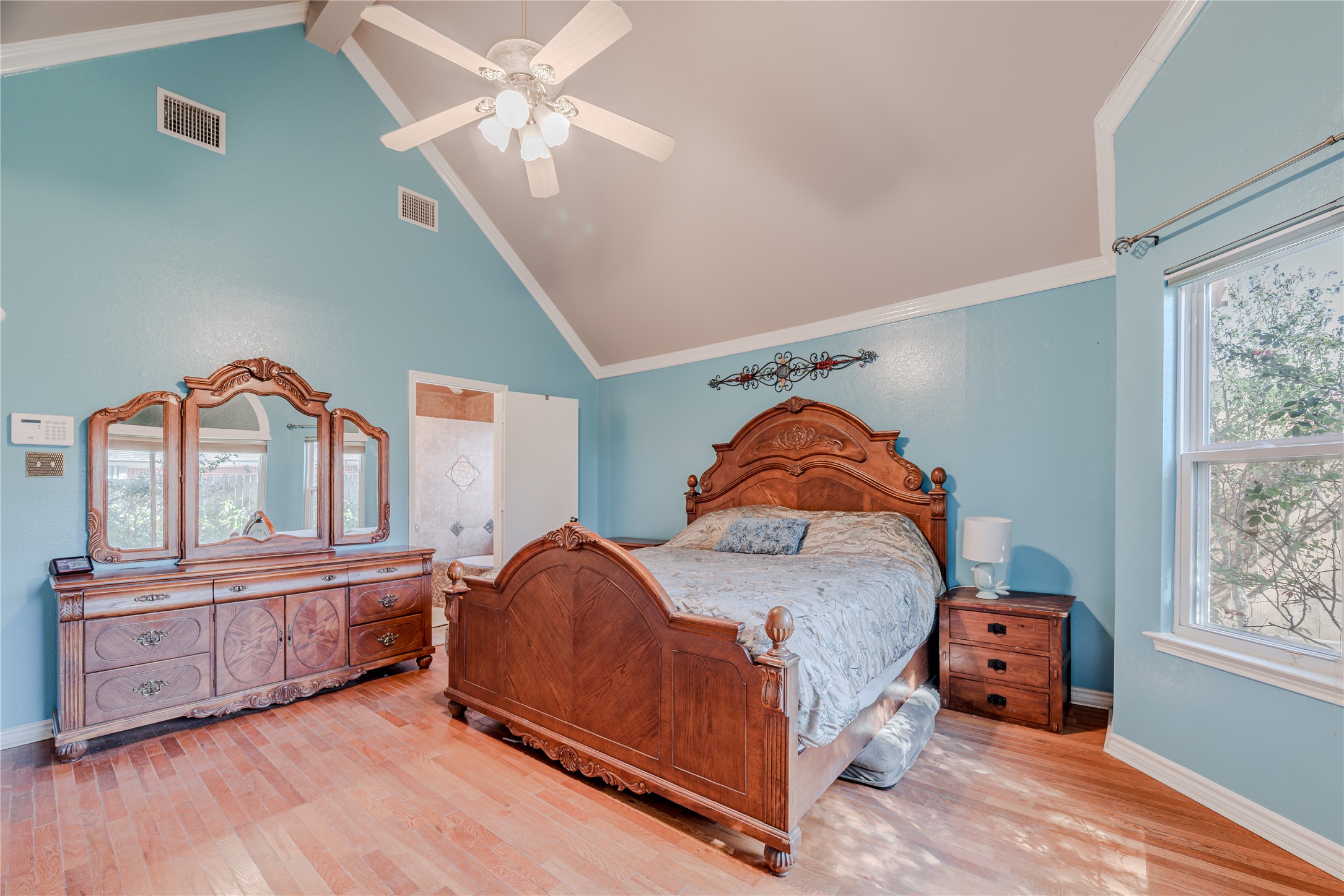 7714 Broken Arrow Street Baytown, TX 77521 - Photo 21 of 41 a bedroom with furniture and a window