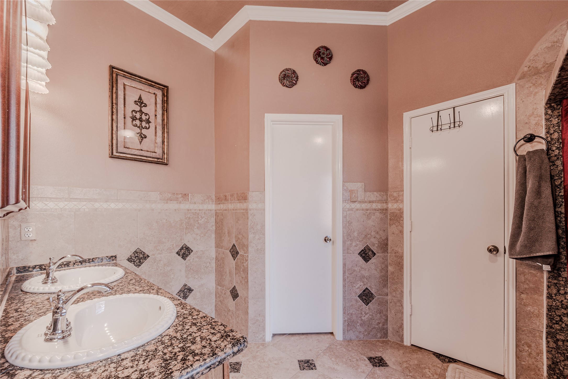 7714 Broken Arrow Street Baytown, TX 77521 - Photo 23 of 41 a bathroom with a sink and a mirror