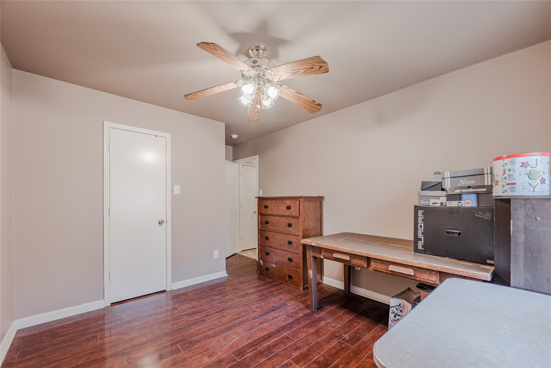 7714 Broken Arrow Street Baytown, TX 77521 - Photo 27 of 41 a room with furniture and wooden floor