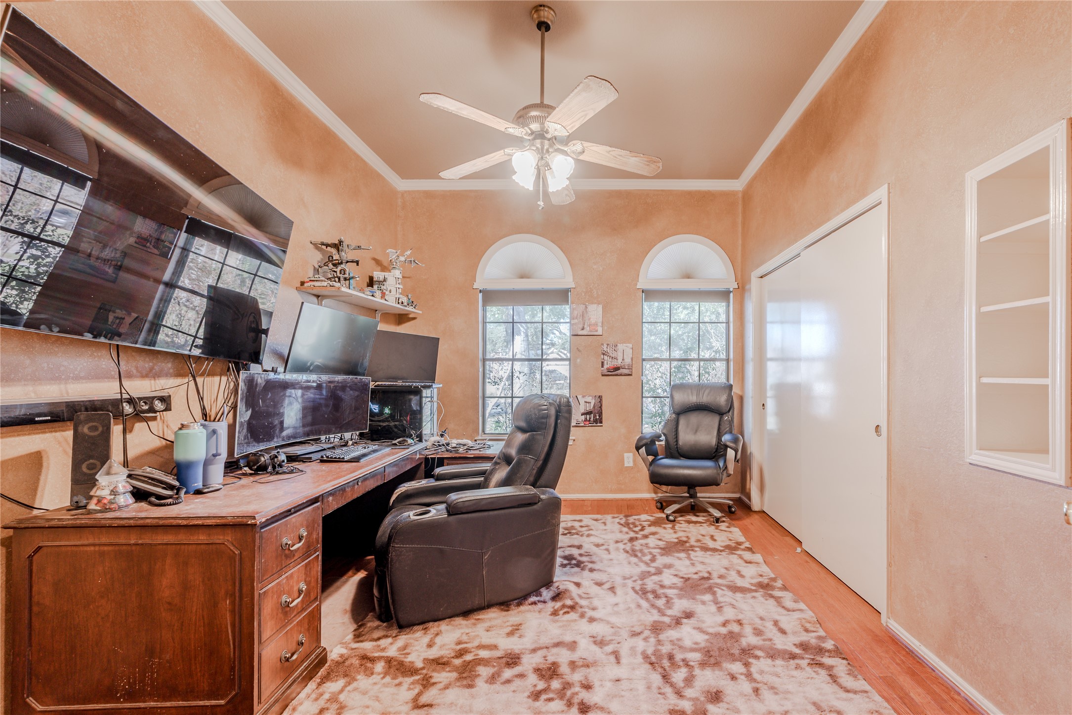 7714 Broken Arrow Street Baytown, TX 77521 - Photo 33 of 41 a room with lots of windows and furniture