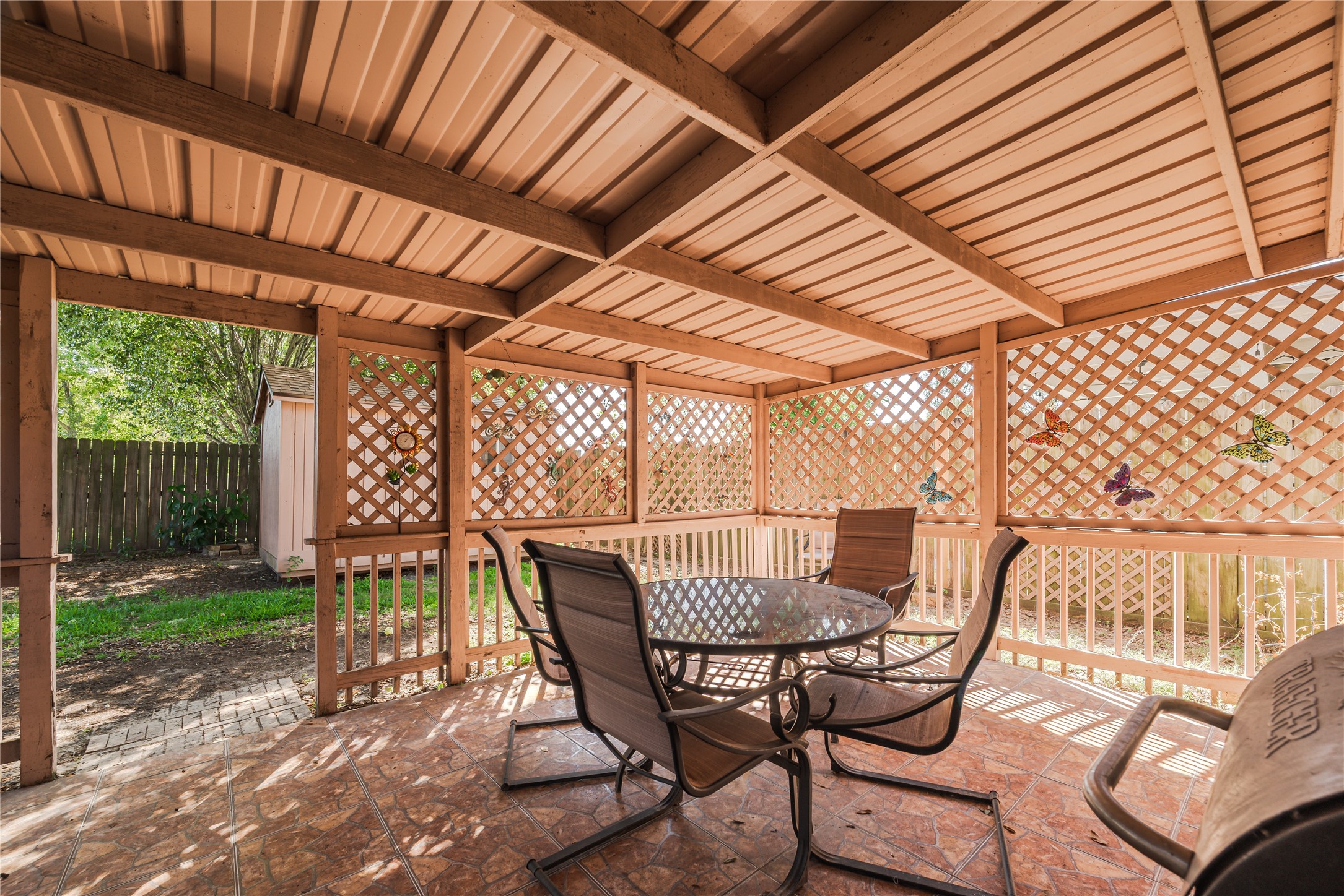 7714 Broken Arrow Street Baytown, TX 77521 - Photo 36 of 41 a patio with table and chairs