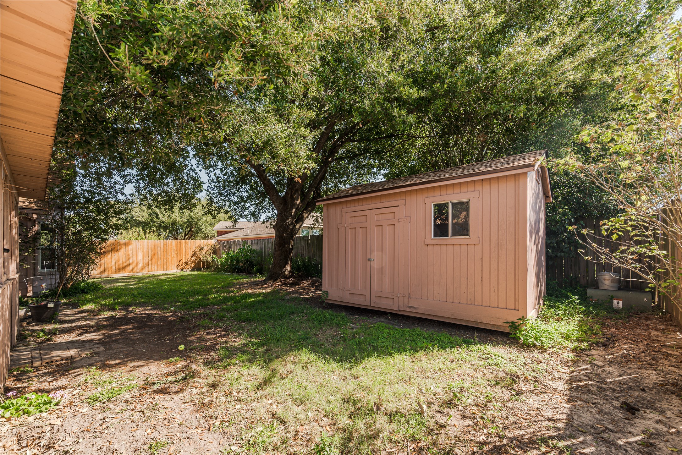 7714 Broken Arrow Street Baytown, TX 77521 - Photo 39 of 41 a backyard of a house with lots of green space