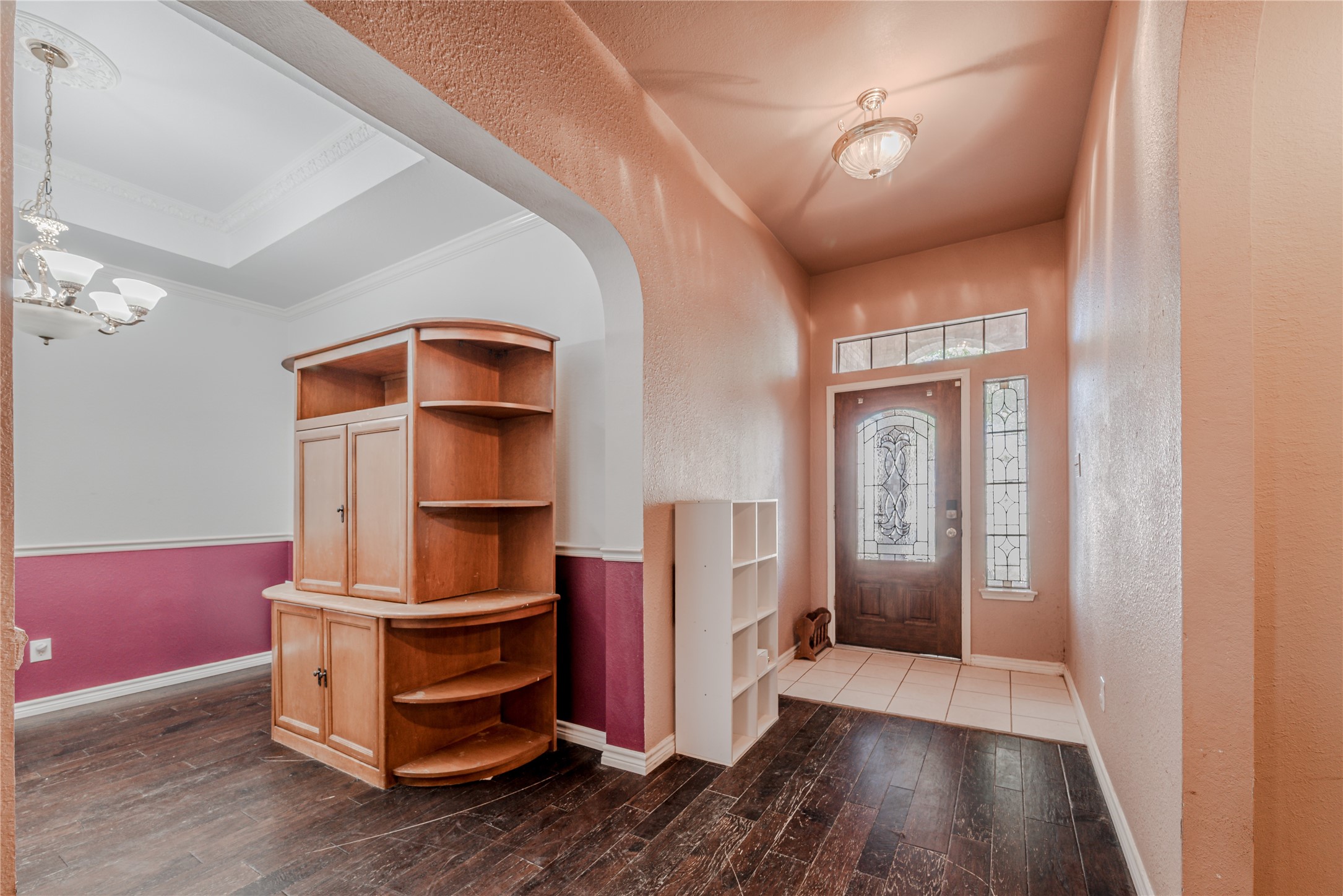 7714 Broken Arrow Street Baytown, TX 77521 - Photo 5 of 41 a view of hallway with stairs and wooden floor